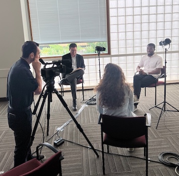 on camera interview with team
